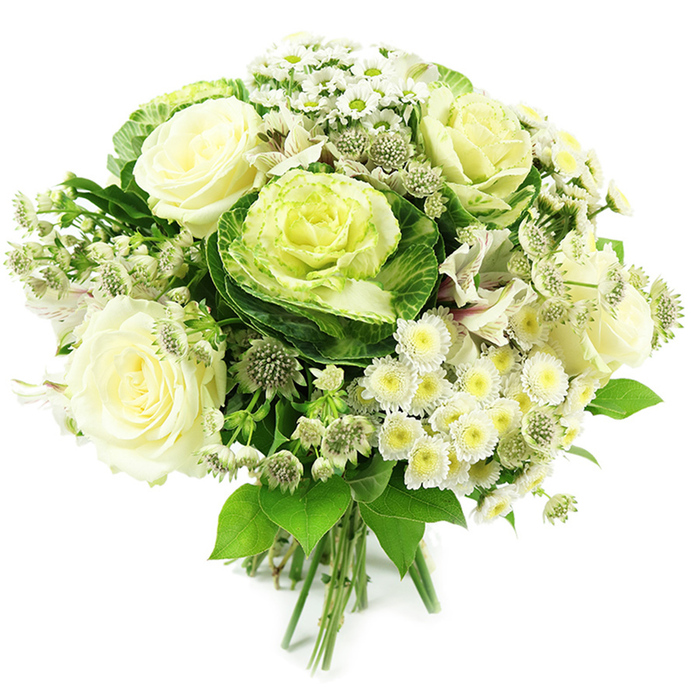 This photograph shows a meticulously crafted hand-tied bouquet dominated by a serene palette of white, cream, and layered greens, set against a spotless white background that makes every petal and leaf stand out. At the visual centre are the ornamental kale rosettes, or flowering cabbages, instantly recognisable by their densely crimped leaves: deep, forest-green edges wrap around hearts that fade into soft lime and pale yellow-green, resembling garden roses sculpted from foliage. Sharing the spotlight, several creamy white roses are fully open, their petals gently curling back in generous spirals, suggesting both softness to the touch and a subtle, classic fragrance. Around these star blooms, clusters of dainty white spray chrysanthemums and small daisy-like flowers form a textured ring, their many slim petals framing warm, yellowish-green centres, bringing an uplifting brightness to the arrangement. Interspersed are slender stems of white alstroemeria with their characteristic fine stripes and occasional blush tones, lending movement and elegance without breaking the monochrome serenity. Tiny, starry astrantia blossoms punctuate the bouquet with intricate, green-tinged white heads, giving the design a slightly wild, natural edge while still feeling polished. A mix of fresh foliage in multiple shades of green cradles the flowers-broad, glossy leaves, finer stems, and perhaps a hint of softer, more muted greenery-echoing the planted borders and small gardens tucked around Sipson and the nearby Heathrow villages. The stems at the base are visibly and neatly bound, testimony to skilled hand-tying and ready to be placed in a simple glass vase on a dining table. The mood is one of refined calm and quiet celebration, perfect for weddings, sympathy tributes, or elegant thank-you gifts delivered across Sipson with care.