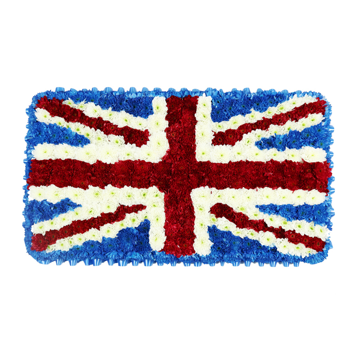 A striking Union Jack funeral tribute is captured against a plain white backdrop, the clean setting allowing the rich colours and textures of the flowers to speak with quiet authority. The rectangular arrangement is completely carpeted in tightly clustered blossoms, giving the surface a soft, padded appearance, like an intricately woven floral tapestry. Deep blue blooms, likely compact hydrangeas or similar clustered flowers, form the background and crisp outer border, their saturated hue echoing the strong blue of the national flag flying over civic buildings and memorials within easy reach of Sipson. Across this base, a prominent red St George's Cross runs from top to bottom and side to side, constructed from dense red chrysanthemums or carnations that lend a sense of depth and weight to the central symbol of England. Diagonal red stripes, representing St Patrick's Cross of Northern Ireland, slice from corner to corner, each carefully measured so the overall geometry of the Union Jack remains perfectly balanced. Surrounding and defining every red line are bands of immaculate white flowers, meticulously placed to create the fimbriation and the broader diagonals of St Andrew's Cross, honouring Scotland within the design. The white blooms bring a sense of purity and clarity, lighting up the arrangement and sharply separating the red from the blue. From a distance, the tribute reads as a flawless Union Jack; up close, it reveals hundreds of individual flowers working together in harmony. The mood is solemn yet proud, ideal for a funeral cortege, graveside farewell, or remembrance service around Sipson where the family wishes to highlight British heritage, military service, or deep ties to the United Kingdom.