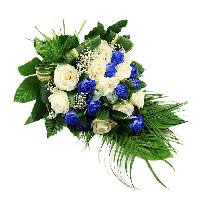 This image shows a luxurious, teardrop-shaped sympathy spray composed of deep blue and creamy white roses, displayed against a clean, white background that accentuates every curve of the design. The upper left of the arrangement is slightly fuller and rounded, then gently narrows as it cascades down to the lower right, echoing the traditional form of a funeral sheaf chosen for services in quiet communities like Sipson. The central focus is the roses themselves: numerous blooms, all fully open, alternate between vibrant sapphire blue and soft ivory white, their ruffled petals overlapping in lush, layered rosettes. The colours create a powerful yet soothing contrast, symbolising both sorrow and peace. Interspersed delicately among the roses are airy tufts of white baby's breath, their tiny flowers dotting the composition like small stars, adding a light, cloudlike texture that breaks up the density of the larger heads. Surrounding this is an abundant mantle of foliage. Broad, glossy dark green leaves support the flowers and give weight to the design, while vivid green ferns lift outward, introducing a feathery texture. Long, slender palm fronds drop elegantly from the bottom of the spray, defining its cascading silhouette. Subtle accents of bluish-green, eucalyptus-like stems weave through the arrangement, their soft-coloured leaves adding depth and a cooler undertone. Several of the broad leaves have been artfully folded into smooth, horizontal bands, almost like decorative ribbons made from living material, showcasing skilled floral craftsmanship. The overall impression is of solemn beauty and refined taste, a thoughtful tribute that would feel at home in a Sipson chapel, crematorium, or home memorial gathering, expressing remembrance, loyalty, and enduring love.