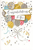 In this image, a beautifully designed congratulations card captures the spirit of a joyful celebration, much like a cosy gathering in a Sipson home after sharing good news. The central illustration is a lush cluster of party balloons, gathered together like a cheerful bouquet. Each balloon is round and softly luminous, depicted in tones of warm gold, cool silver, champagne beige, sky blue, soft pink, and misty grey. They are decorated with dainty stars, thin stripes, and sparkling flecks of glitter, giving each balloon a slightly different personality while still belonging to the same festive family. The balloons overlap gracefully, suggesting they're floating upwards, held together by fine gold and silver strings that curl downward in elegant lines. Around this main cluster, tiny metallic stars, dots, and swirling ribbons drift across a pale, gently shaded background, hinting at confetti tossed into the air on a celebratory evening near Sipson's quiet streets. Running through the centre of the arrangement is a curved banner bearing the words Congratulations To You in stylish, flowing calligraphy, the lettering soft yet confident, like a warm voice offering praise. The card's overall finish suggests a pleasant mix of smooth cardstock, shiny ink, and a subtle sparkle that would catch the light on a windowsill. It gives the impression of lightness and refined joy, making it an ideal companion to fresh flowers sent for exam success, new jobs, or any milestone in Sipson where you want your message of pride and happiness to feel genuinely special and thoughtfully chosen.
